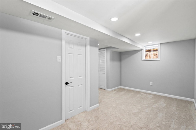 basement with light colored carpet