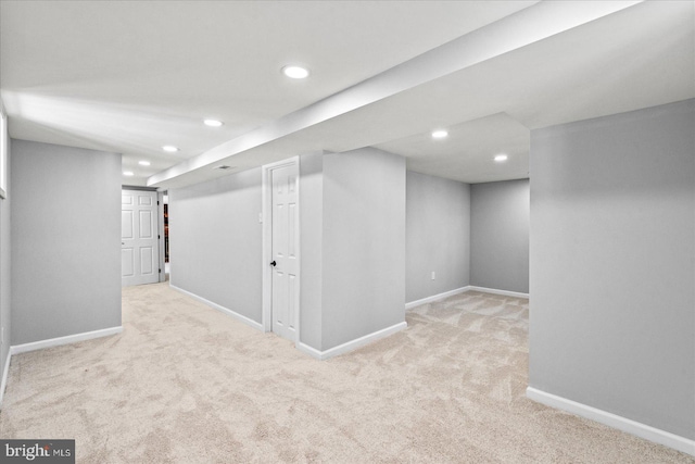 basement with light colored carpet