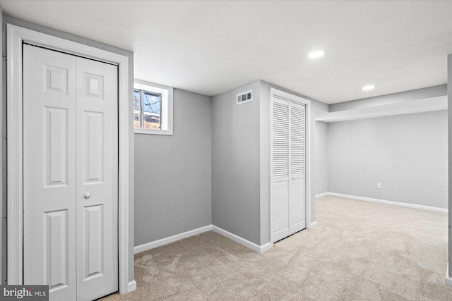 basement with light colored carpet