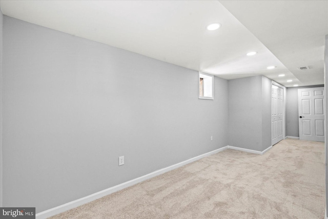 basement with light colored carpet