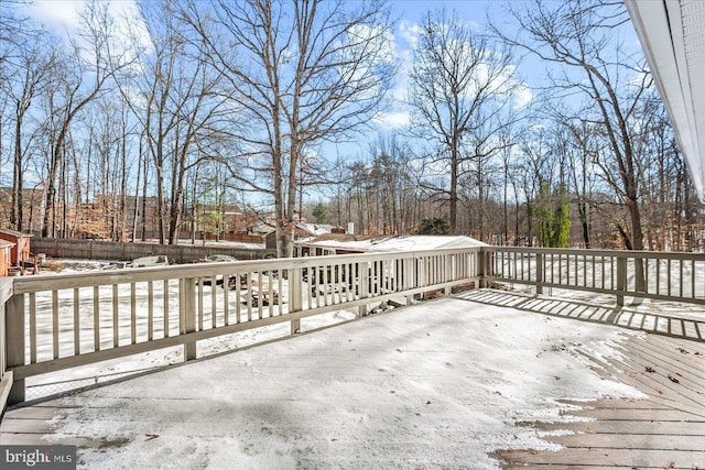 view of snow covered deck