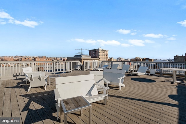 wooden terrace with a view of city