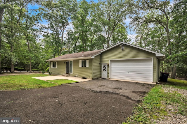 ranch-style home with a front lawn and a garage