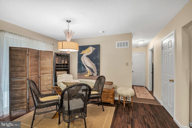 dining room featuring dark wood-type flooring