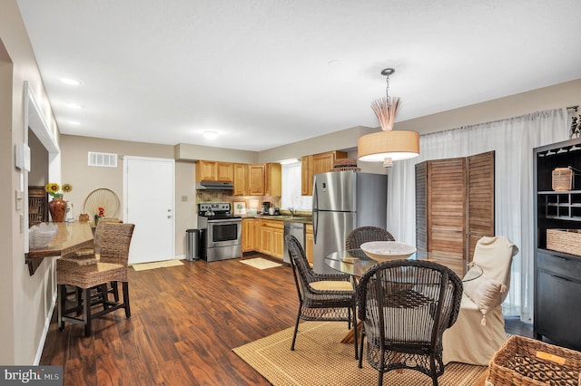 dining room featuring dark hardwood / wood-style floors and sink