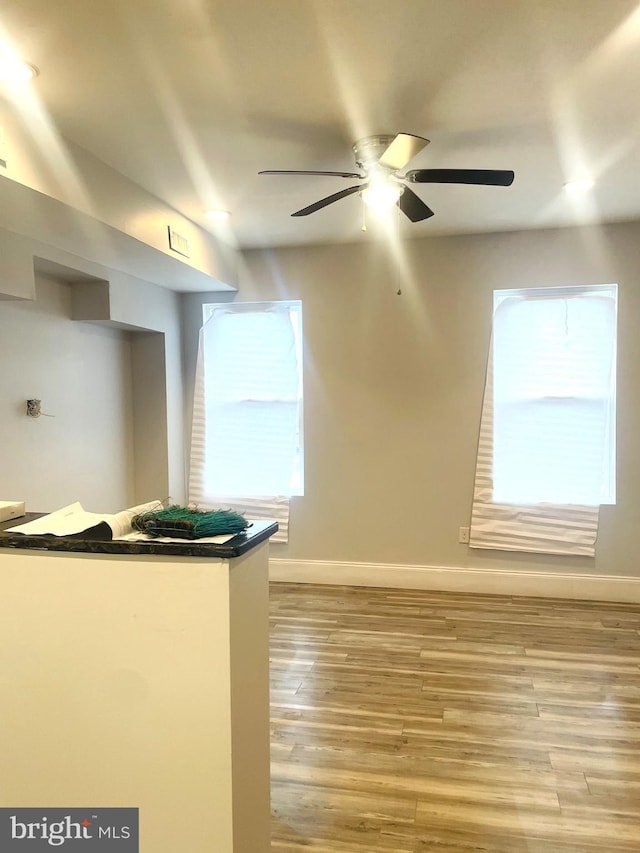 kitchen featuring light wood-type flooring and ceiling fan