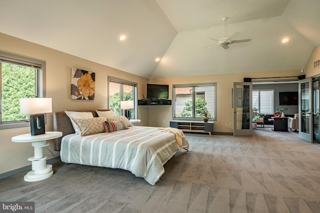 carpeted bedroom featuring french doors, vaulted ceiling, and ceiling fan