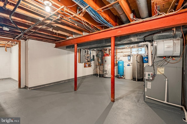 basement featuring heating unit, electric panel, and gas water heater