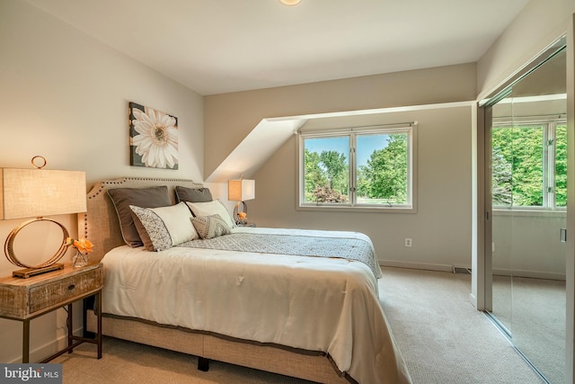 bedroom featuring light colored carpet