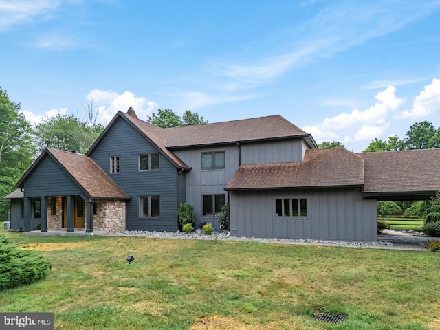 back of house featuring a yard