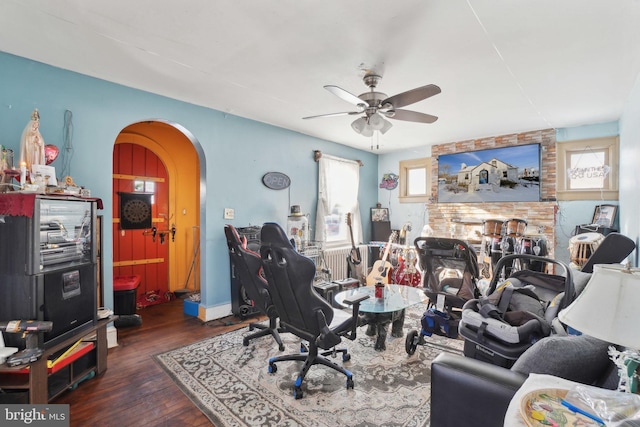 office space featuring ceiling fan, dark hardwood / wood-style floors, and plenty of natural light