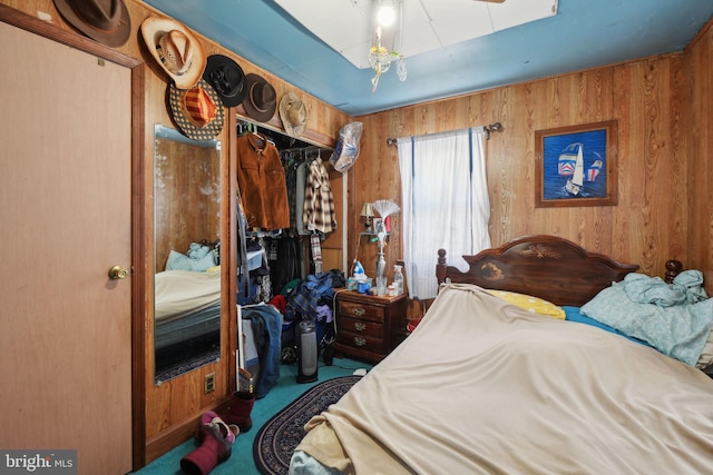 bedroom with wood walls