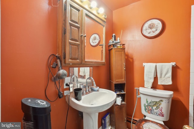 bathroom featuring sink and toilet