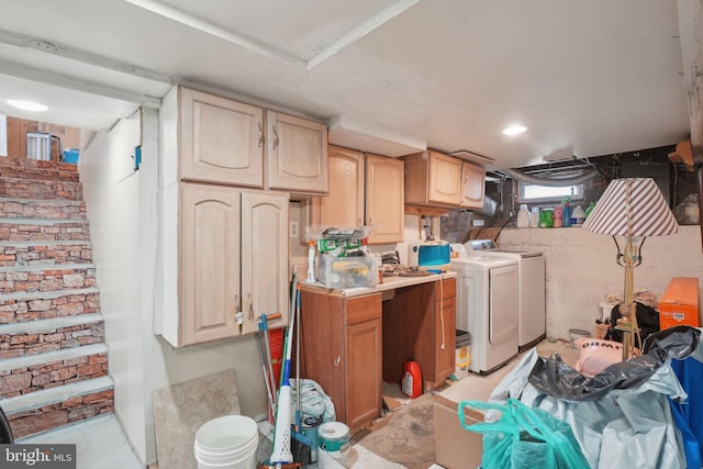 clothes washing area with washer and clothes dryer