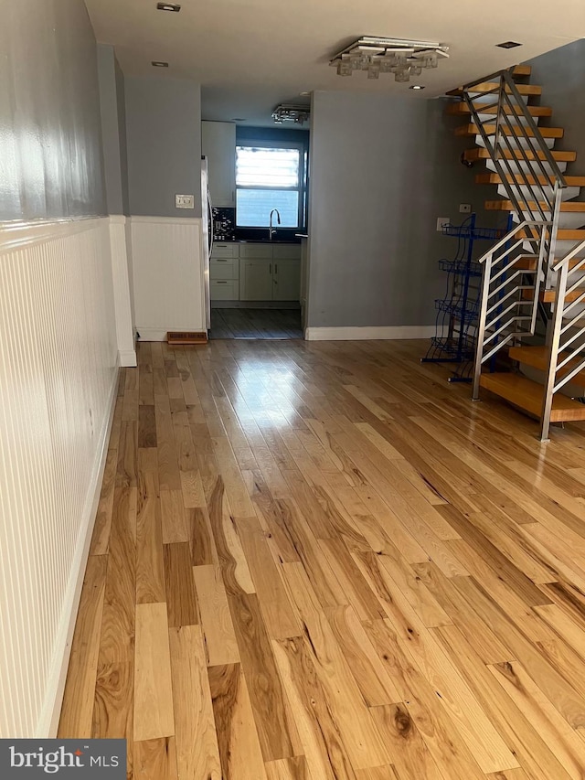 interior space featuring sink and light wood-type flooring