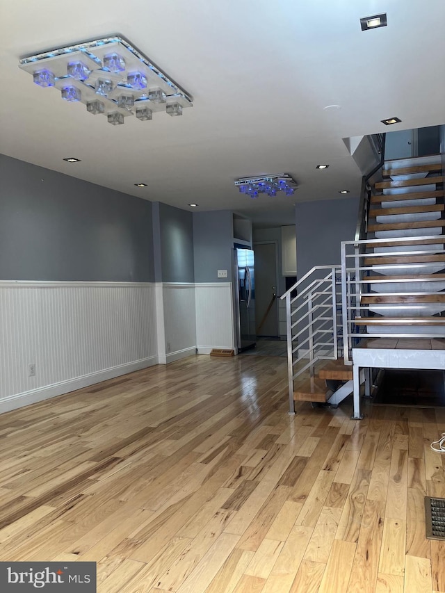 stairway featuring wood-type flooring