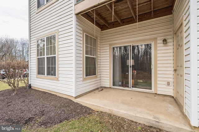 property entrance featuring a patio