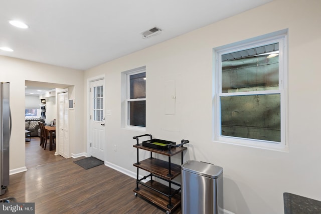 foyer entrance featuring dark hardwood / wood-style flooring