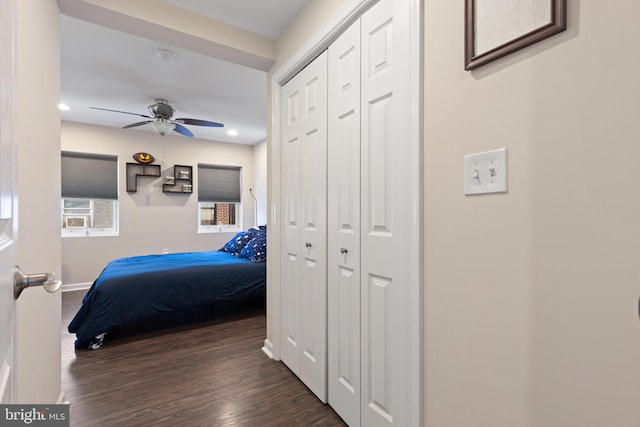 bedroom with ceiling fan and dark hardwood / wood-style floors