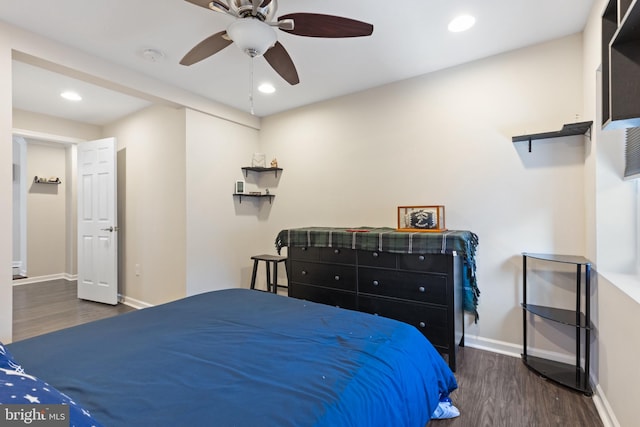 bedroom featuring ceiling fan and dark hardwood / wood-style flooring