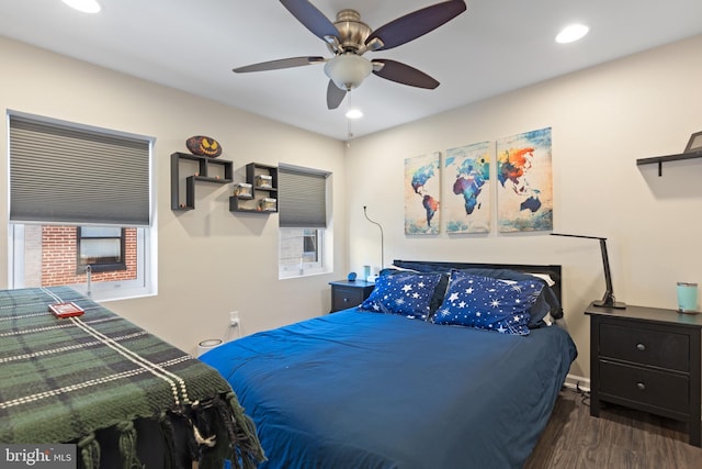 bedroom featuring ceiling fan and dark hardwood / wood-style floors