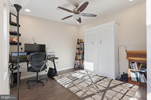 office area featuring ceiling fan and dark hardwood / wood-style floors