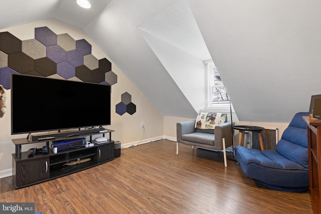 living room featuring lofted ceiling and wood-type flooring