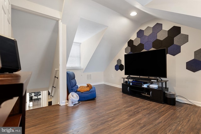 interior space featuring hardwood / wood-style flooring and vaulted ceiling