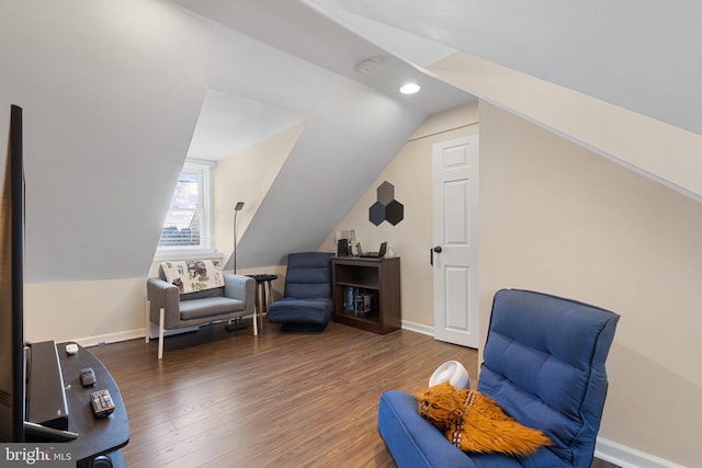 sitting room with dark hardwood / wood-style flooring and vaulted ceiling