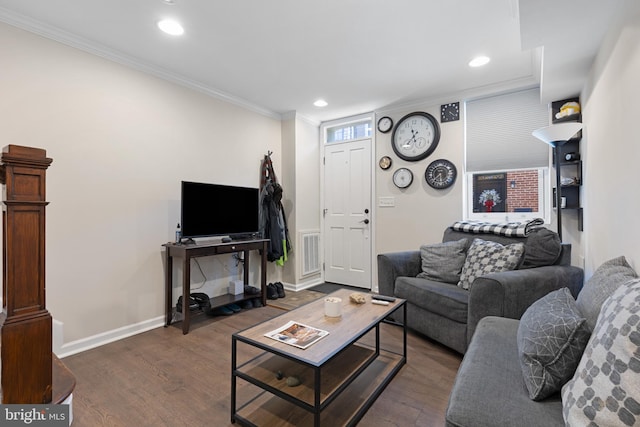 living room featuring dark hardwood / wood-style floors and ornamental molding