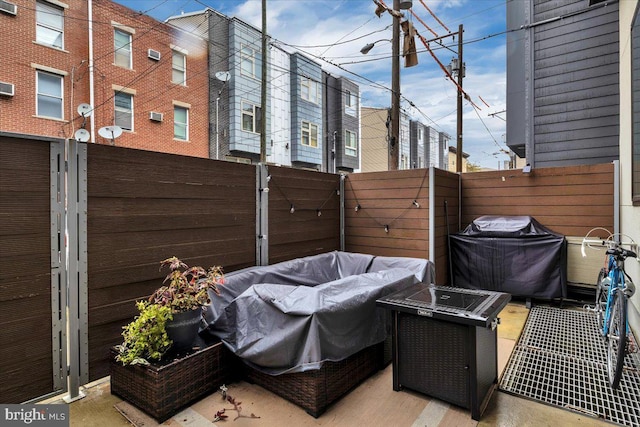 view of patio featuring a fire pit and grilling area