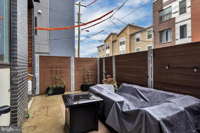 view of patio featuring a fire pit