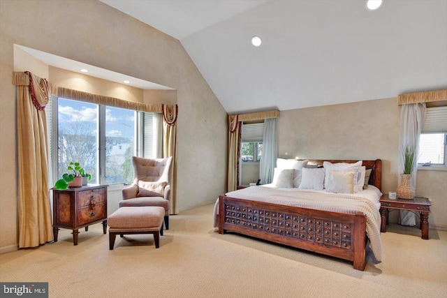 bedroom featuring high vaulted ceiling and light colored carpet