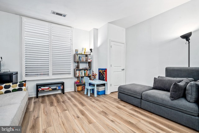 living room with light hardwood / wood-style flooring