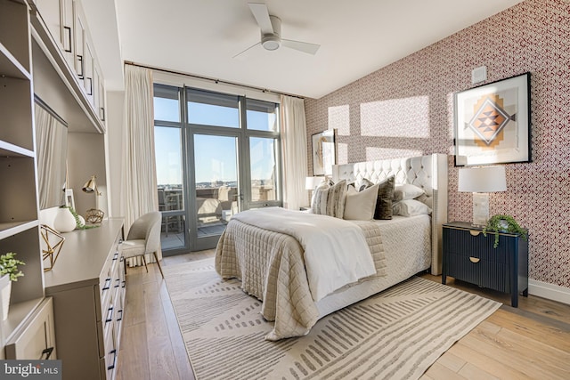 bedroom featuring ceiling fan, access to outside, and light hardwood / wood-style flooring