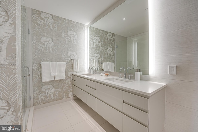 bathroom featuring tile patterned floors, vanity, and an enclosed shower