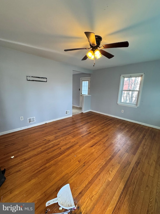 unfurnished room featuring hardwood / wood-style floors and ceiling fan