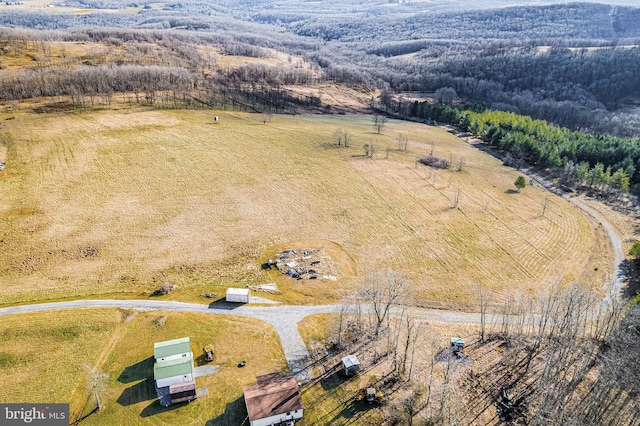 birds eye view of property featuring a rural view