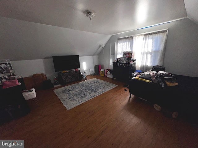 bonus room featuring vaulted ceiling and hardwood / wood-style flooring