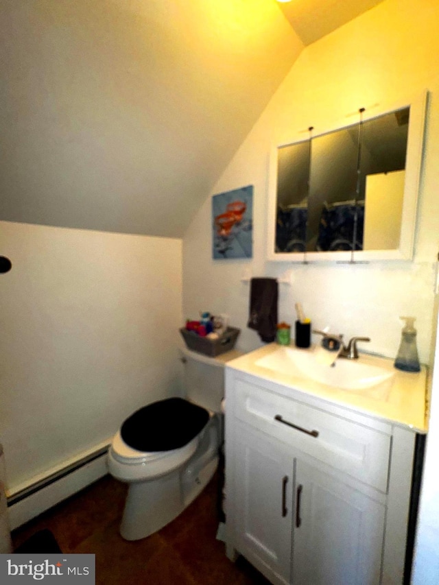 bathroom featuring toilet, a baseboard heating unit, vaulted ceiling, and vanity