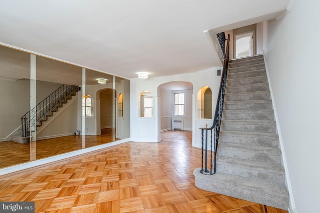 entryway with light parquet flooring