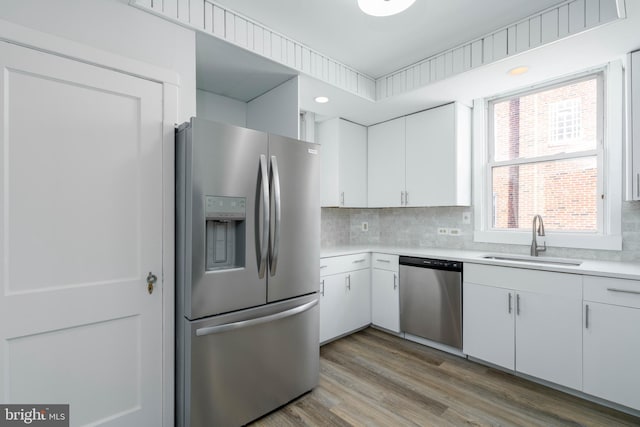 kitchen with white cabinetry, sink, and appliances with stainless steel finishes