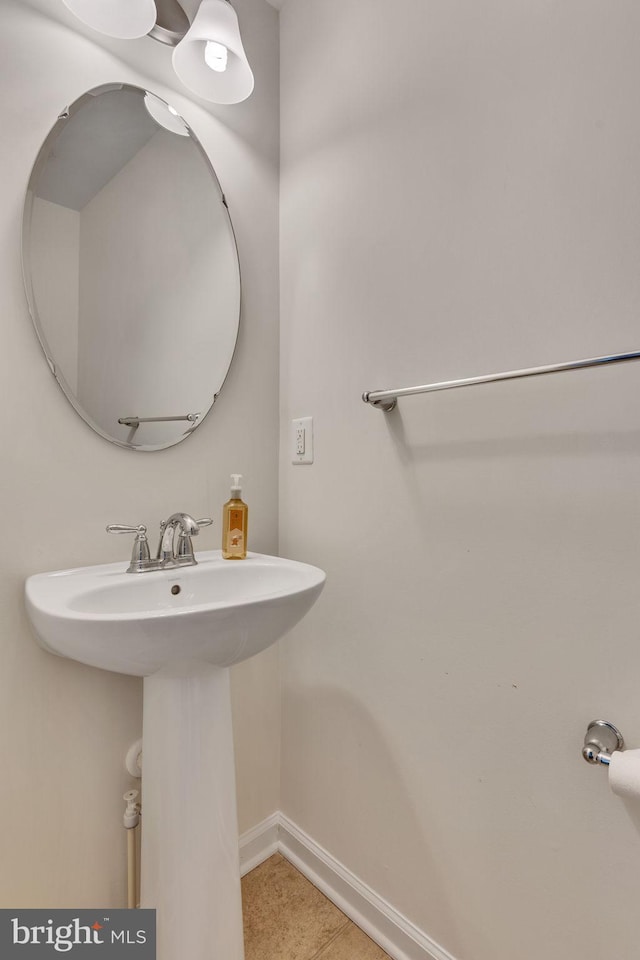 bathroom with tile patterned flooring and sink