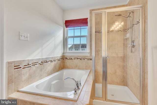 bathroom with shower with separate bathtub