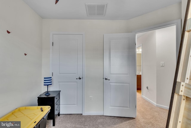 bedroom with light carpet