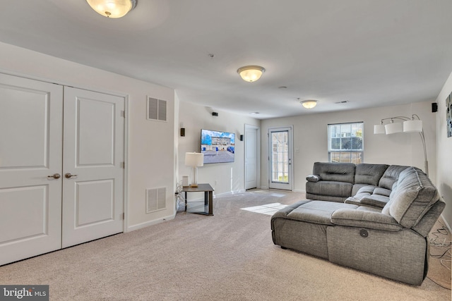 living room featuring light colored carpet