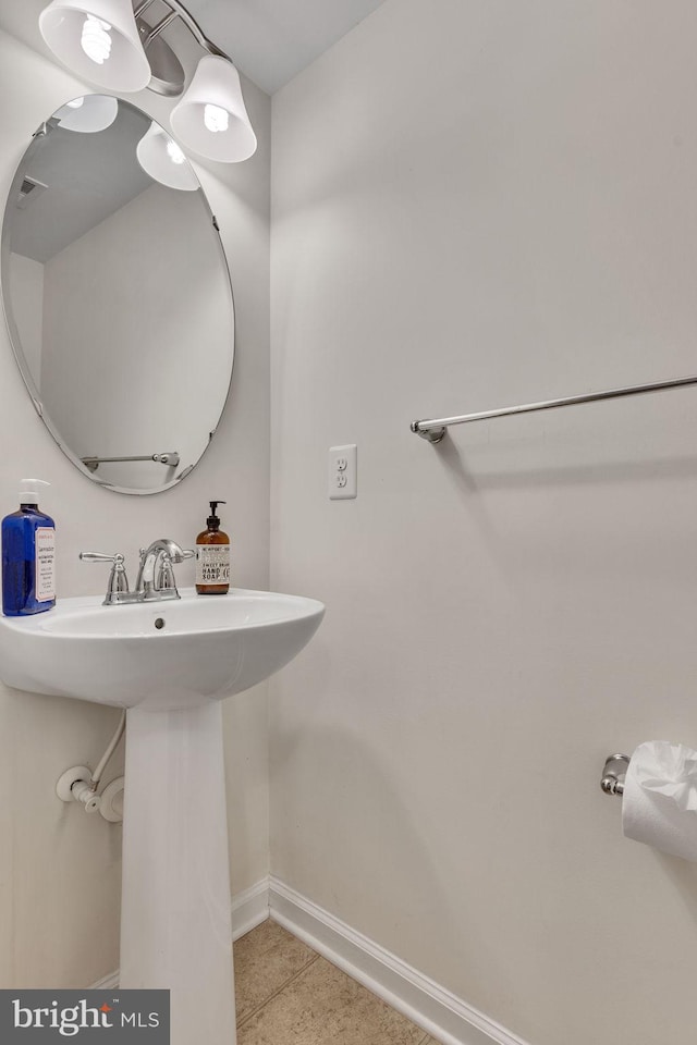 bathroom with tile patterned floors and sink