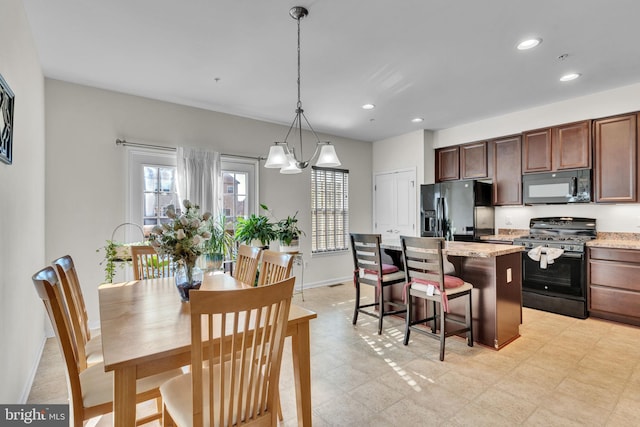 dining space featuring a notable chandelier