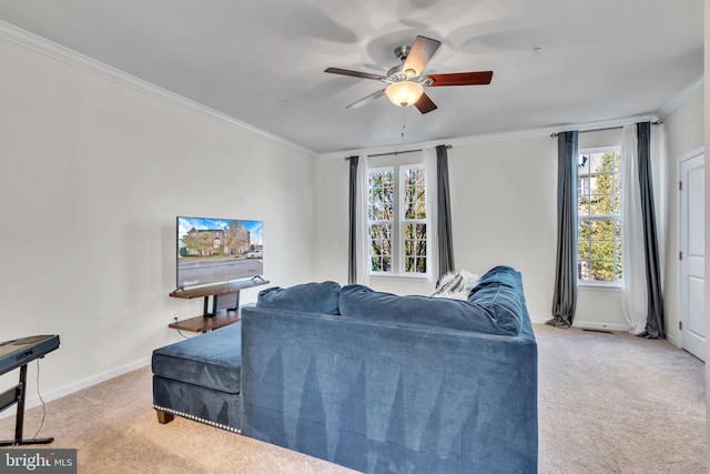 carpeted living room featuring ceiling fan and ornamental molding