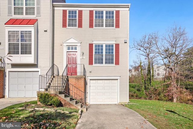 townhome / multi-family property featuring a garage